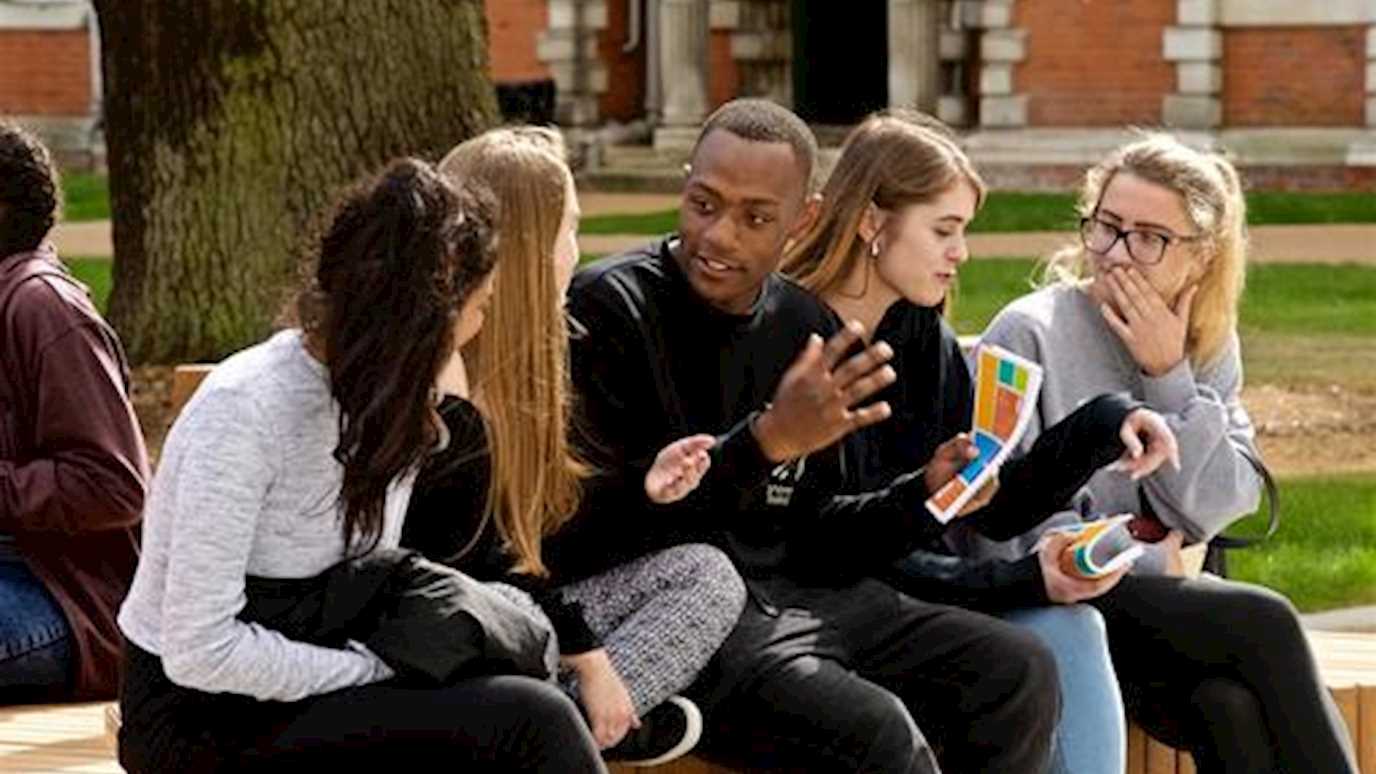 students sitting and talking outside finders - Being a student