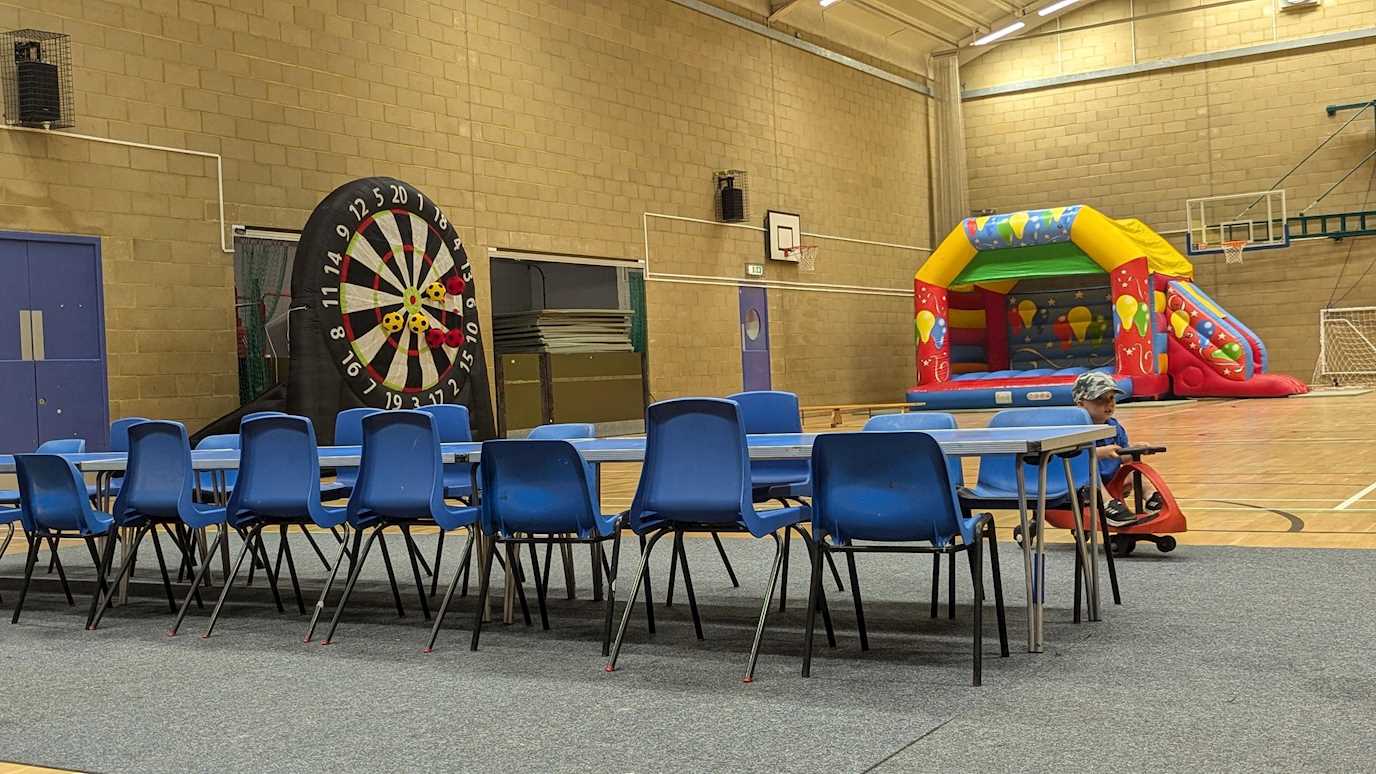 Sports Hall birthday party with football dartboard and inflatable 2024