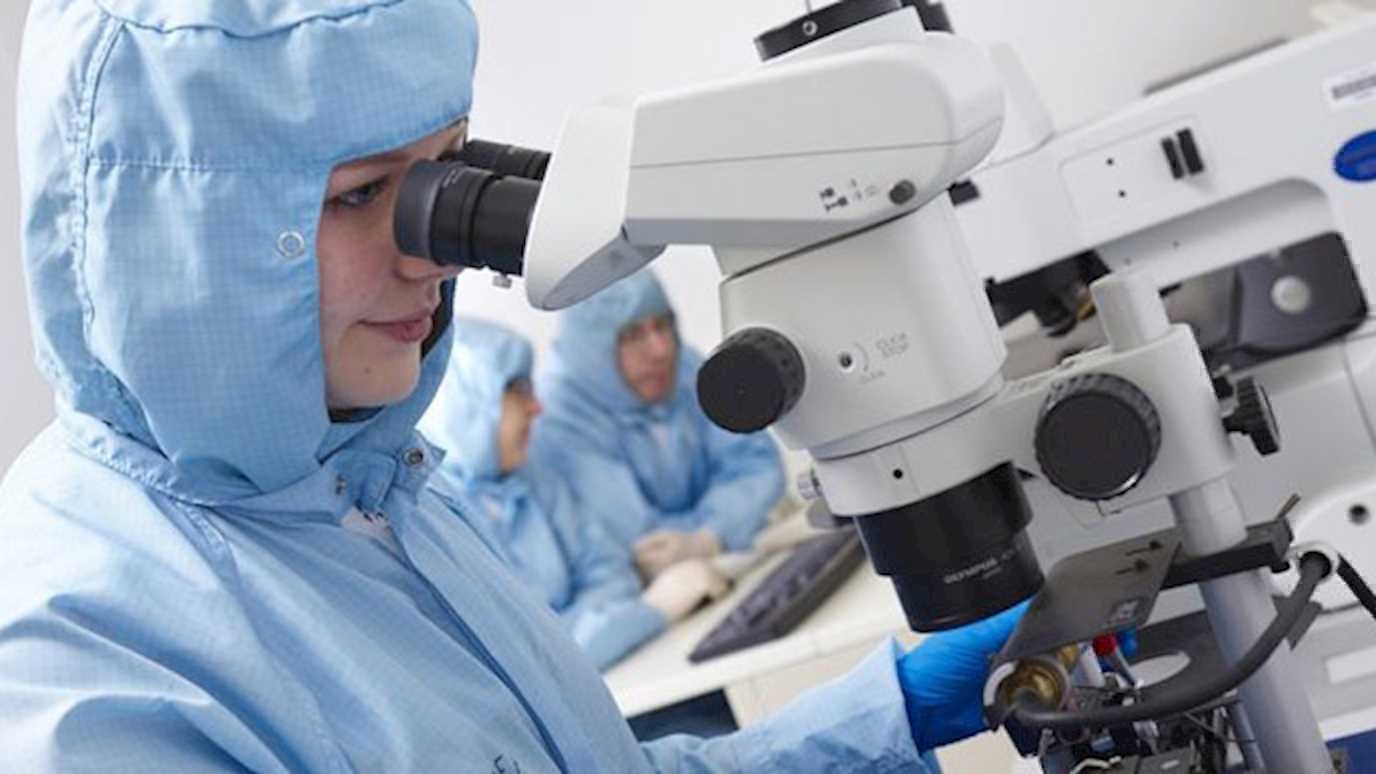 Quantum Nanofabrication scientist at a microscope in the cleanroom Superfab